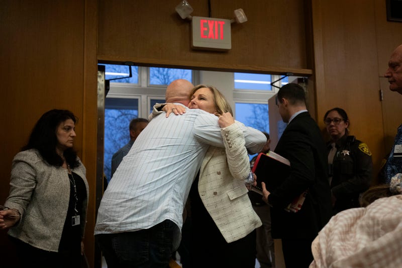 Father of Oxford High School victim Justin Shilling hugs Oakland County Prosecutor Karen McDonald after James Crumbley's guilty verdict.