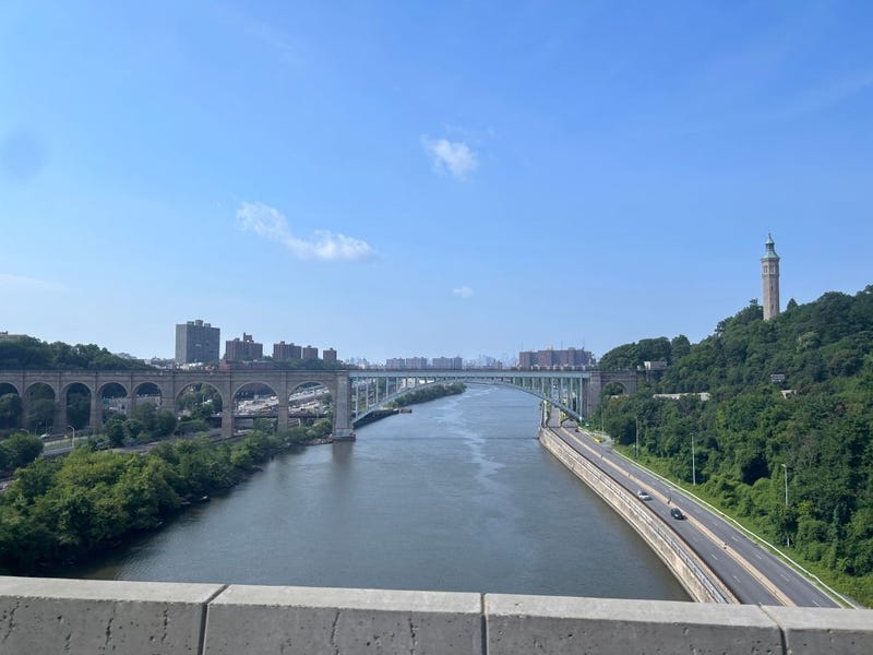 The High Bridge over Harlem River looking north towards The Bronx with The Hope Center tower.