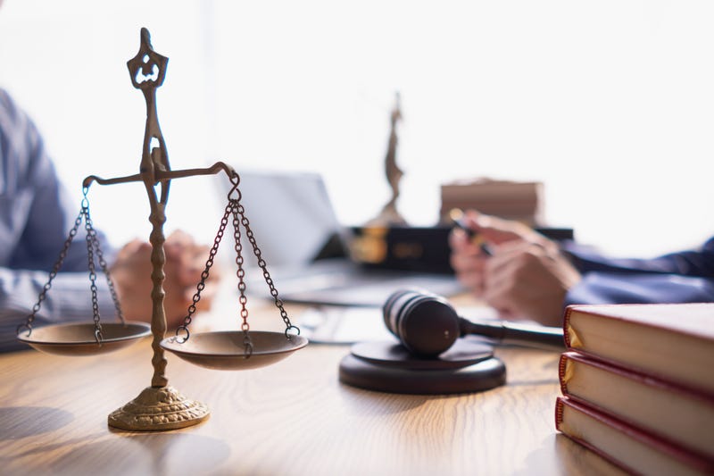 The Scales of Justice sits on an attorney's desk
