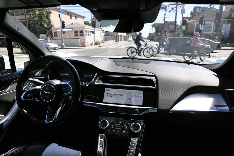 A Waymo autonomous self-driving Jaguar taxi drives along a street near Venice Beach on March 14, 2024, in Los Angeles, California.