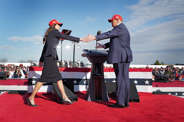 Republican presidential candidate former President Donald Trump greets South Dakota Gov. Kristi Noem during a rally at the Dayton International Airport on March 16, 2024 in Vandalia, Ohio. 