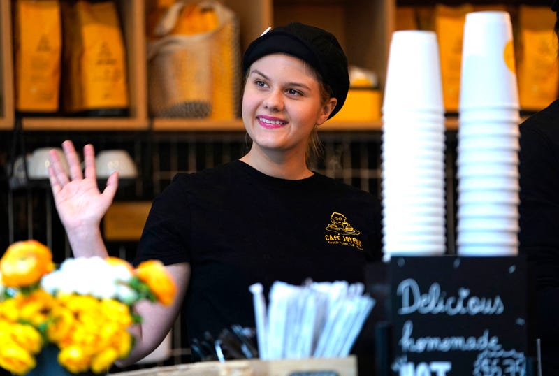 Rachel waves to customers at Café Joyeux's in Manhattan on March 15, 2024.