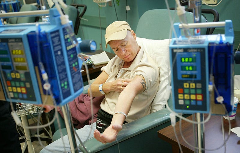Cancer patient Ellen Walsh checks her muscle tone during chemotherapy treatment at Cape Fear Valley Medical Center June 17, 2003 in Fayetteville, North Carolina.