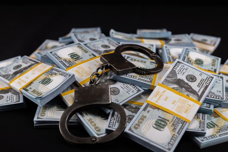 Stock image of money and handcuffs
