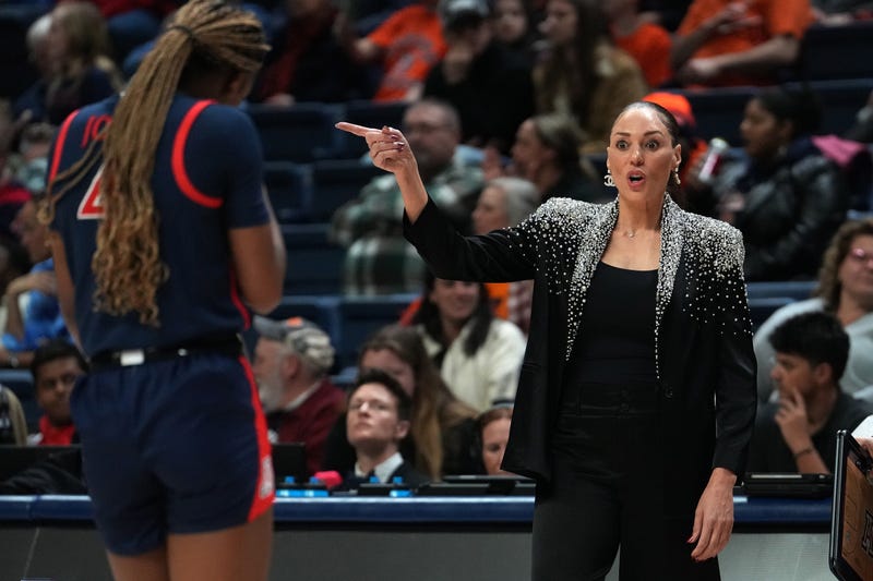 Arizona Wildcats head coach Adia Barnes talks to Skylar Jones #4 during the first half of a First Four game of the NCAA Women's Basketball Tournament at the Harry A. Gampel Pavilion on March 21, 2024, in Storrs, Connecticut.