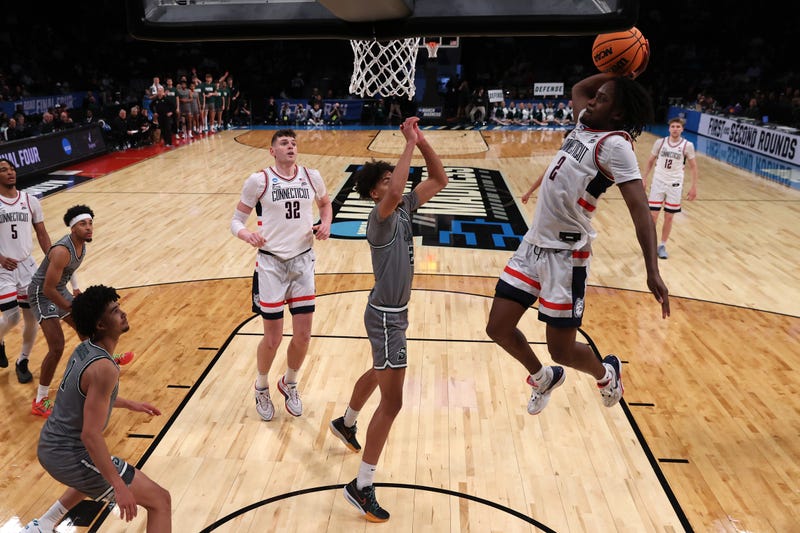 Tristen Newton of UConn goes up for a dunk against the Stetson Hatters in the NCAA Men's Basketball Tournament in Brooklyn, NY, 3/22/24