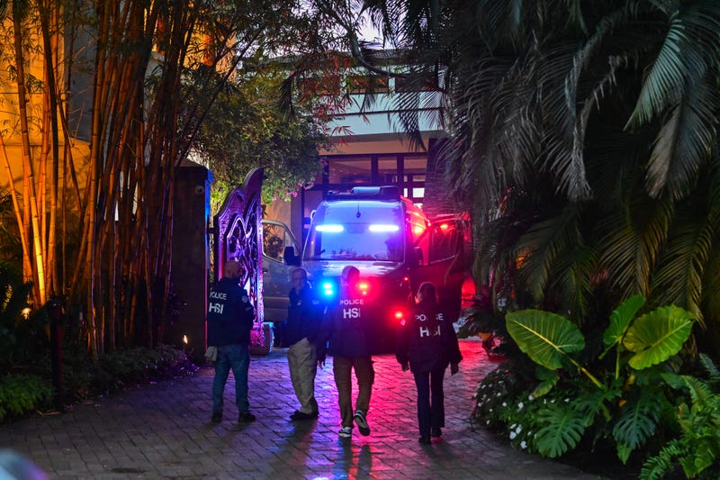 Homeland Security Investigation agents are seen at the entrance of music mogul Sean "Diddy" Combs' home at Star Island in Miami Beach on March 25, 2024