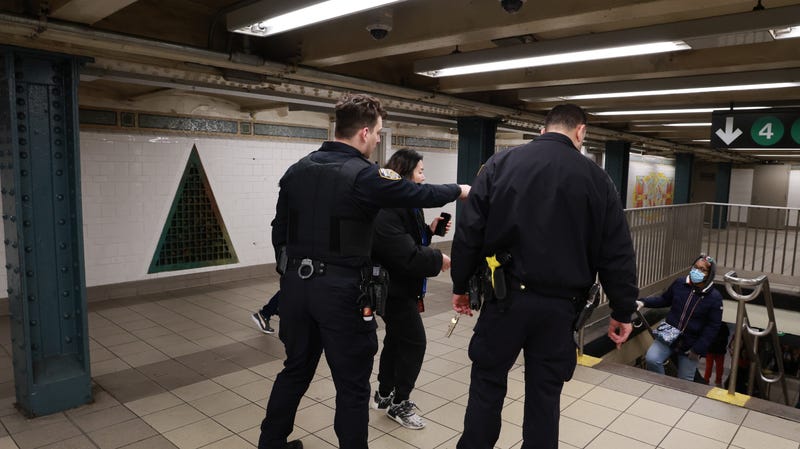 NYPD officers investigate an assault at the 125th Street station on the Lexington Avenue line