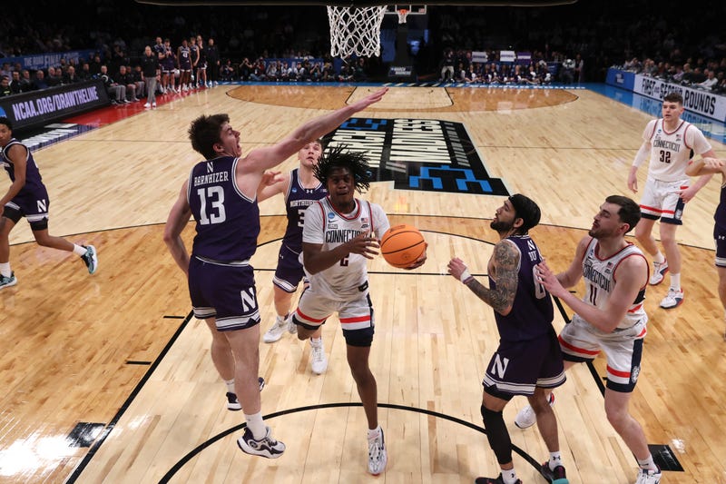 Tristen Newton of UConn drives to the basket against the Northwestern Wildcats during the second round of the NCAA Men's Basketball Tournament in Brooklyn, NY, 3/24/24  