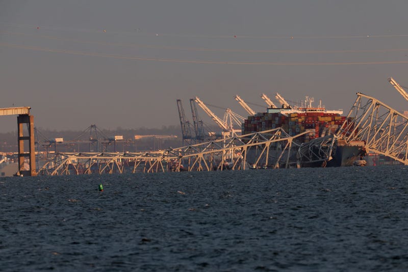 A cargo ship is shown after running into and collapsing the Francis Scott Key Bridge on March 26, 2024 in Baltimore, Maryland. Rescuers are searching for at least seven people, authorities say, while two others have been pulled from the Patapsco River.