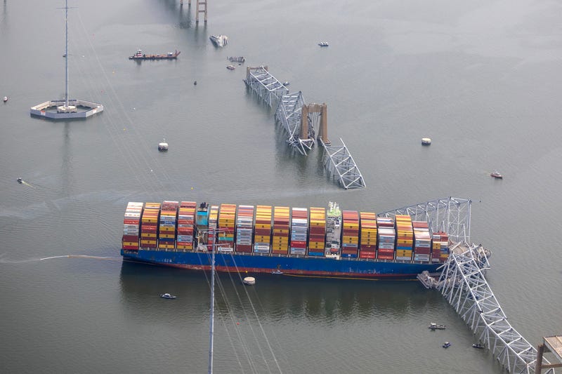 In an aerial view, cargo ship Dali is seen after running into and collapsing the Francis Scott Key Bridge on March 26, 2024 in Baltimore, Maryland