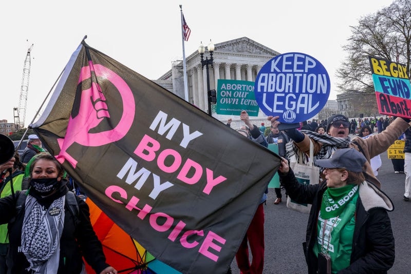 Demonstrators hold up signs during a protest in front of the Supreme Court during the "Bans Off Our Mifepristone" action organized by the Woman's March outside of the Supreme Court on March 26, 2024 in Washington, DC. (Photo by Jemal Countess/Getty Images for Women's March)