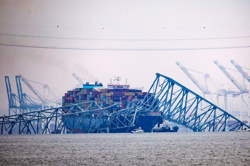Cargo ship Dali sits in the water after running into and collapsing Baltimore's Francis Scott Key Bridge on March 27, 2024 in Baltimore, Maryland. Two survivors were pulled from the Patapsco River and six missing people are presumed dead after the Coast Guard called off search and rescue efforts. A work crew was fixing potholes on the bridge, which is used by roughly 30,000 people each day, when the ship struck at around 1:30am on Tuesday morning. The accident has temporarily closed the Port of Baltimore, one of the largest and busiest on the East Coast of the U.S.