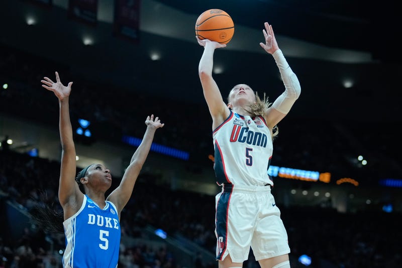 Paige Bueckers #5 of the Connecticut Huskies drives past Oluchi Okananwa #5 of the Duke Blue Devils during the first half in the Sweet 16 round of the NCAA Women's Basketball Tournament at Moda Center on March 30, 2024 in Portland, Oregon.