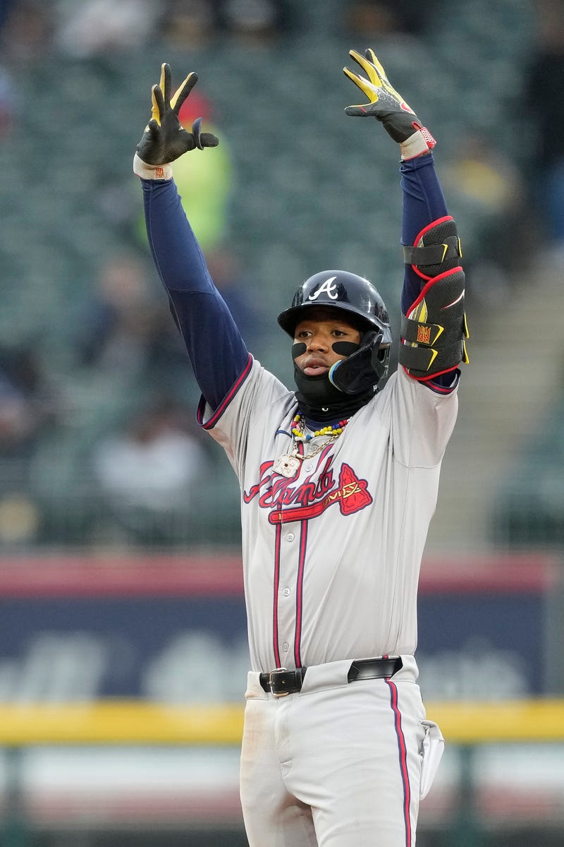 Ronald Acuna Jr. #13 of the Atlanta Braves celebrates after hitting a double during the sixth inning against the Chicago White Sox at Guaranteed Rate Field 