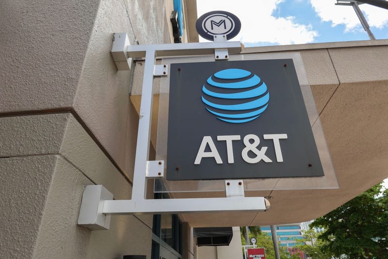 An AT&T sign hangs outside of a store on April 01, 2024, in Miami, Florida. AT&T acknowledged a massive leak involving the data of 73 million current and former subscribers. They reported that they had reset passcodes for millions of customers after the hack. (Photo by Joe Raedle/Getty Images)
