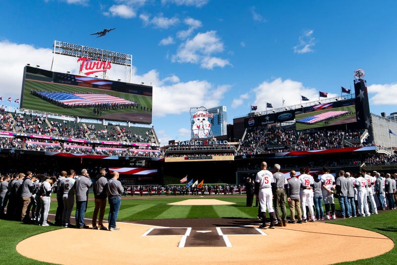 Members of the Minnesota Twins line up for the national anthem before the home opener at Target Field on April 4, 2024 in Minneapolis, Minnesota. 