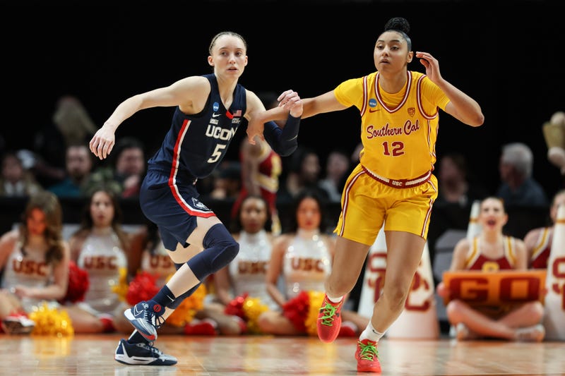 Paige Bueckers #5 of the Connecticut Huskies defends JuJu Watkins #12 of the USC Trojans during the second half in the Elite 8 round of the NCAA Women's Basketball Tournament at Moda Center on April 01, 2024 in Portland, Oregon.