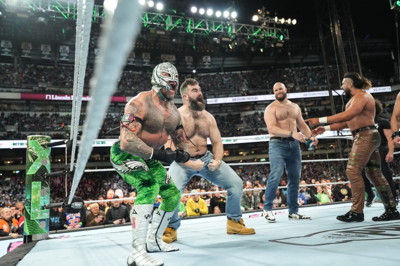 Rey Mysterio and Jason Kelce celebrating their win against Legado del Fantasma during Night One of WrestleMania 40 at Lincoln Financial Field on April 6, 2024 in Philadelphia.