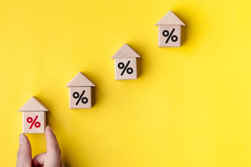 hand women holding wooden block with percentage sign, Interest rate and dividend concept, interest rate, tax, VAT, real estate, return on stocks and mutual funds, business growth income and profit.