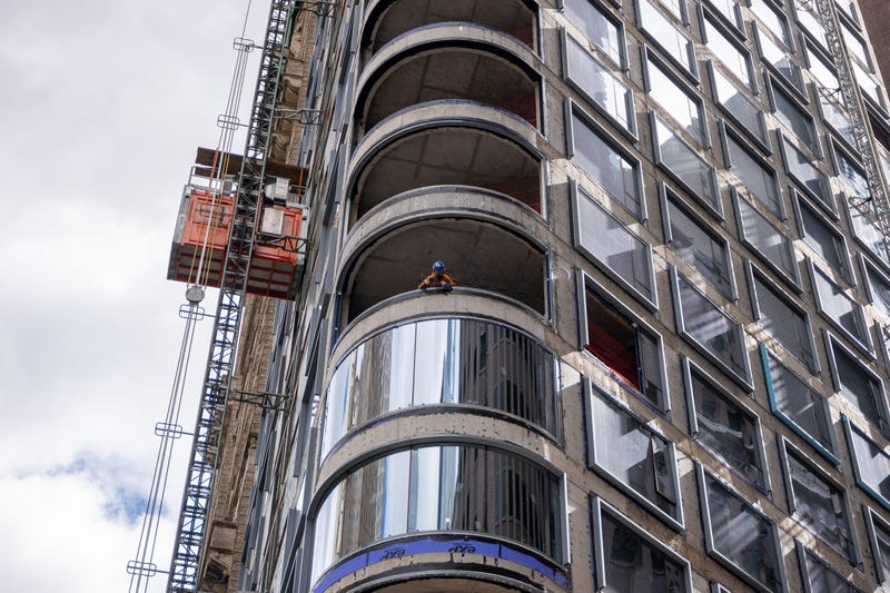 A worker peers out from a worksite in lower Manhattan moments after New York City and parts of New Jersey experienced a 4.8 magnitude earthquake on April 05, 2024 in New York City.