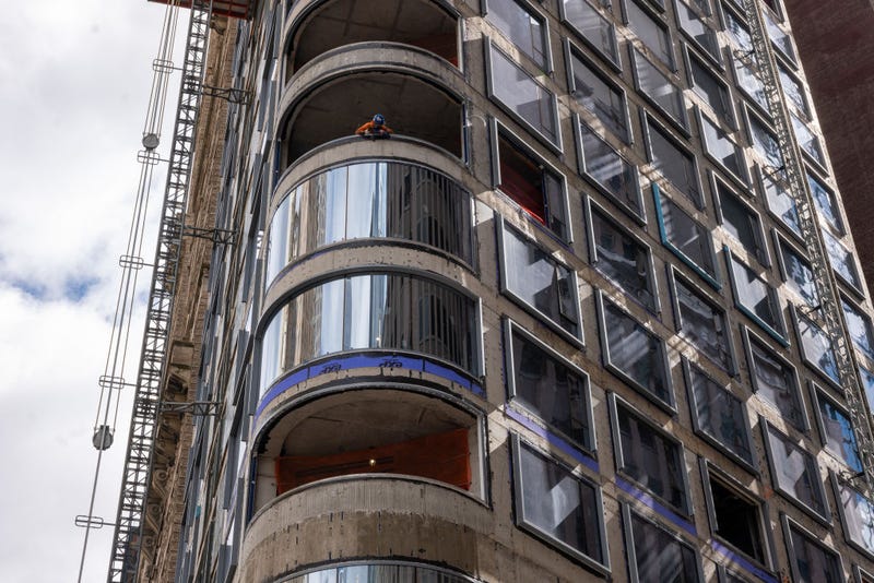 A worker peers out from a worksite in lower Manhattan moments after New York City and parts of New Jersey experienced a 4.8 magnitude earthquake on April 05, 2024 in New York City. 
