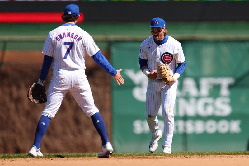 Cubs shortstop Dansby Swanson (7) and second baseman Nico Hoerner celebrate.