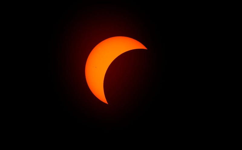 The moon begins to eclipse the sun on April 8, 2024 in Fort Worth, Texas.