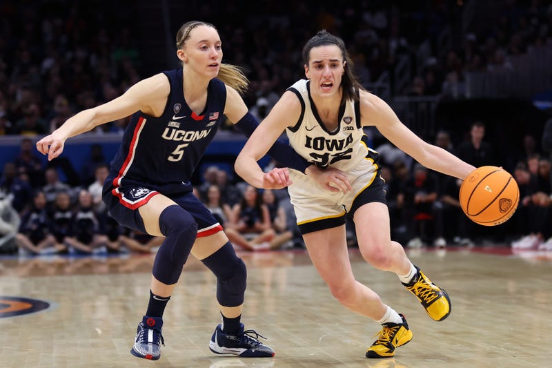 Caitlin Clark #22 of the Iowa Hawkeyes dribbles around Paige Bueckers #5 of the UConn Huskies in the second half during the NCAA Women's Basketball Tournament Final Four semifinal game at Rocket Mortgage Fieldhouse on April 05, 2024 in Cleveland, Ohio.