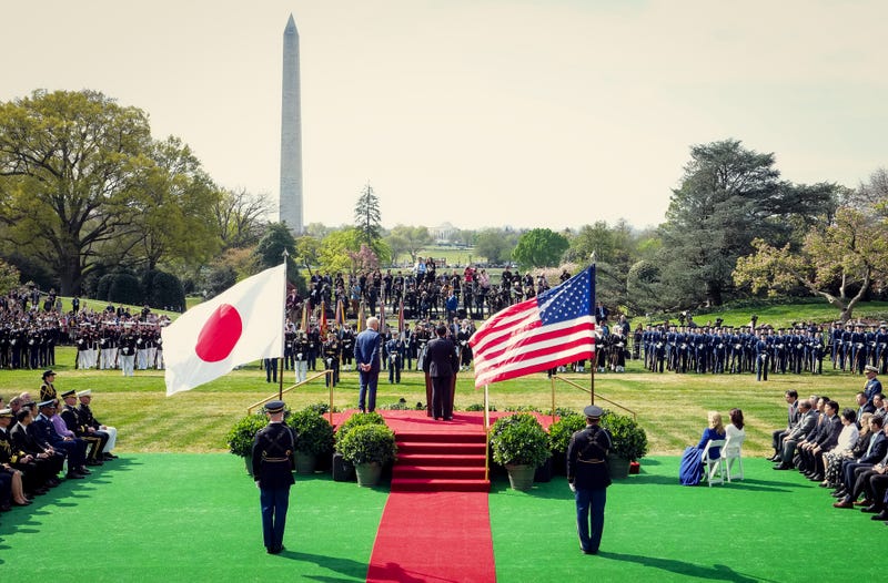 Japanese Prime Minister Fumio Kishida (C) delivers remarks alongside U.S. President Joe Biden during an arrival ceremony at the White House on April 10, 2024