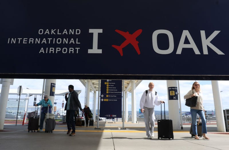 Travelers walk towards Terminal 2 at Oakland International Airport on April 12, 2024 in Oakland, California. The Board of Commissioners for the Port of Oakland voted on Thursday to proceed with a plan to change the name of Oakland International Airport to the San Francisco Bay Oakland International Airport.