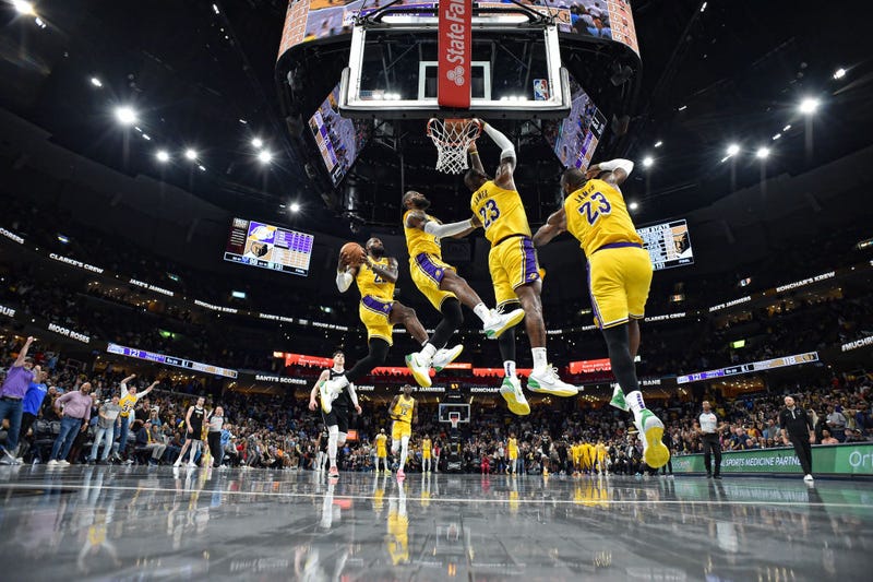 LeBron James #23 of the Los Angeles Lakers goes to the basket during the second half of the game against the Memphis Grizzlies at FedExForum on April 12, 2024 in Memphis, Tennessee.