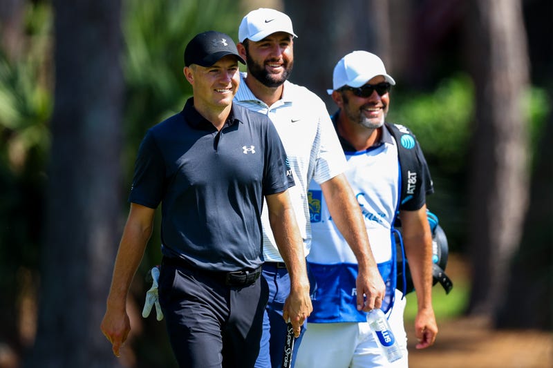 Jordan Spieth and Scottie Scheffler walk to the second hole green during the first round of the RBC Heritage at Harbour Town Golf Links on April 18, 2024, in Hilton Head Island, South Carolina.