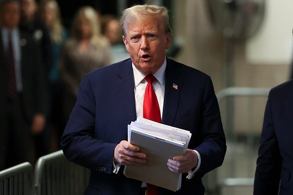 Former U.S. President Donald Trump speaks to the media while departing Manhattan Criminal Court