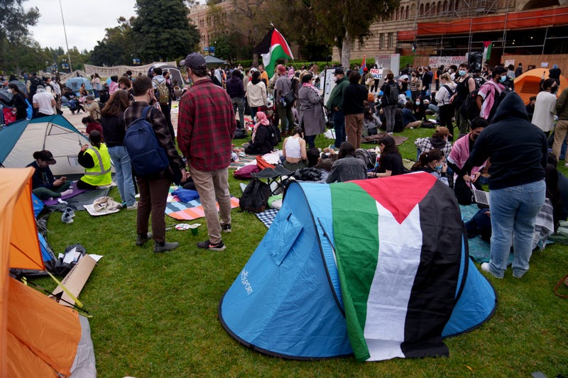Pro-Palestine demonstrators occupy an encampment on the campus of UCLA on April 25, 2024 in Los Angeles, California. Activists at UCLA have joined a range of campuses across the United States who have started encampments to call on their universities to divest financial ties from Israel.
