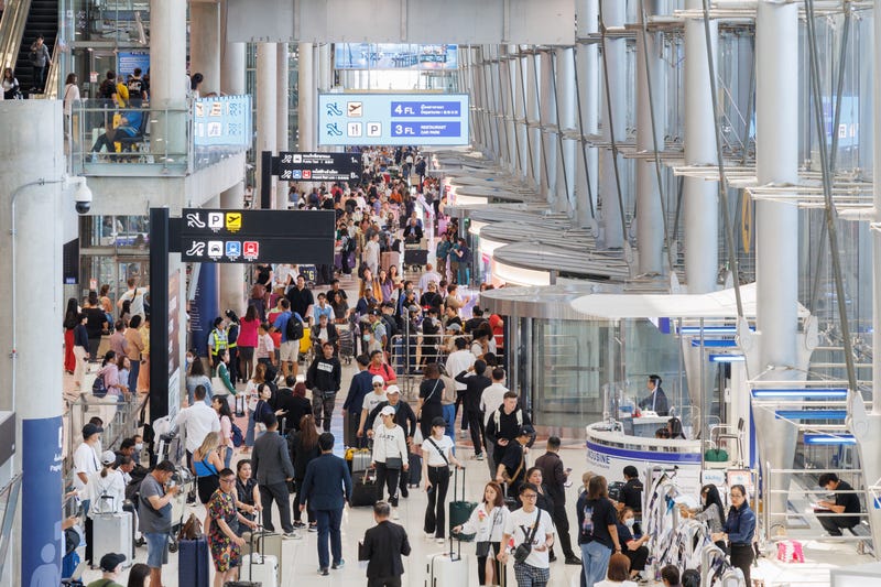 Travelers in a busy airport