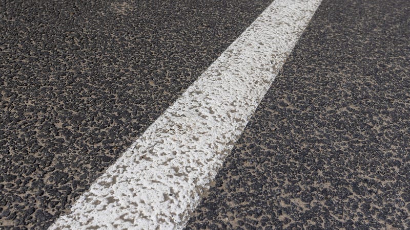 Details of a highway with a white painted line - stock photo