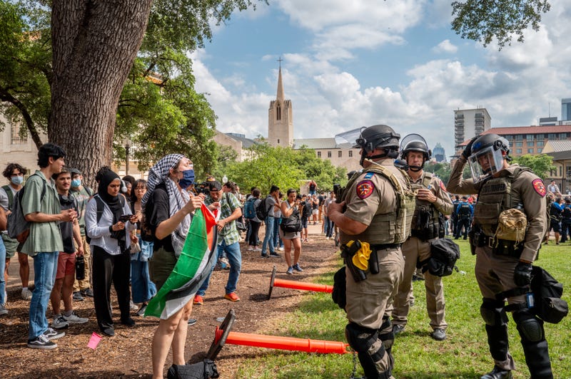 Students speak with law enforcement during a pro-Palestine protest at the University of Texas at Austin on April 24, 2024, in Austin, Texas.