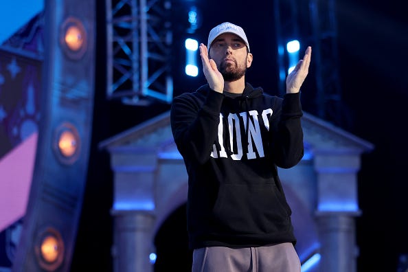 Rapper Marshall "Eminem" Mathers claps during the first round of the 2024 NFL Draft