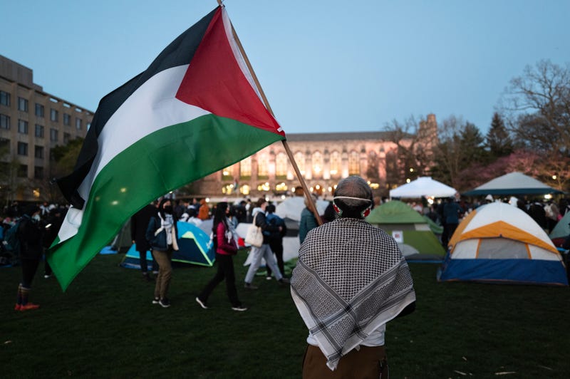 People rally on the campus of Northwestern University