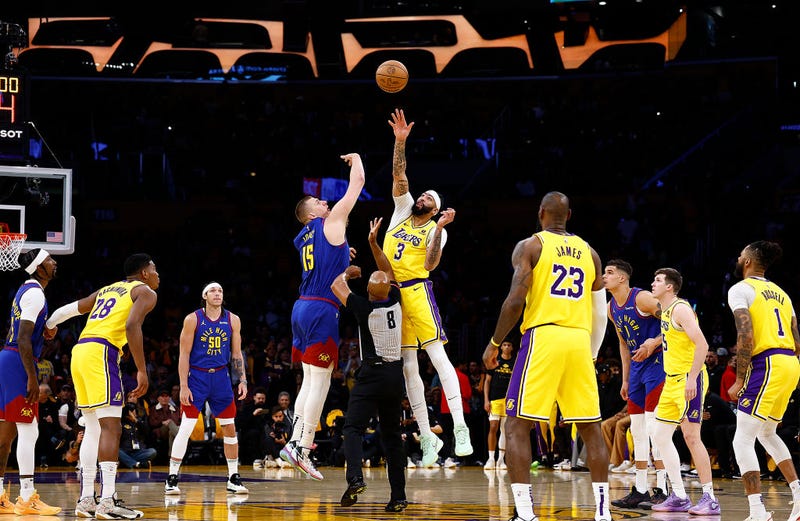 The opening tip-off between Nikola Jokic #15 of the Denver Nuggets and Anthony Davis #3 of the Los Angeles Lakers during game three of the Western Conference First Round Playoffs at Crypto.com Arena on April 25, 2024 in Los Angeles, California.