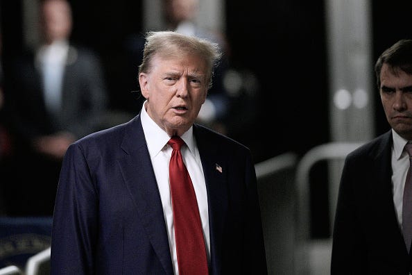 Former U.S. President Donald Trump speaks to the media as he arrives to court with attorney Todd Blanche (R) during his trial for allegedly covering up hush money payments at Manhattan Criminal Court on April 30, 2024 in New York City.