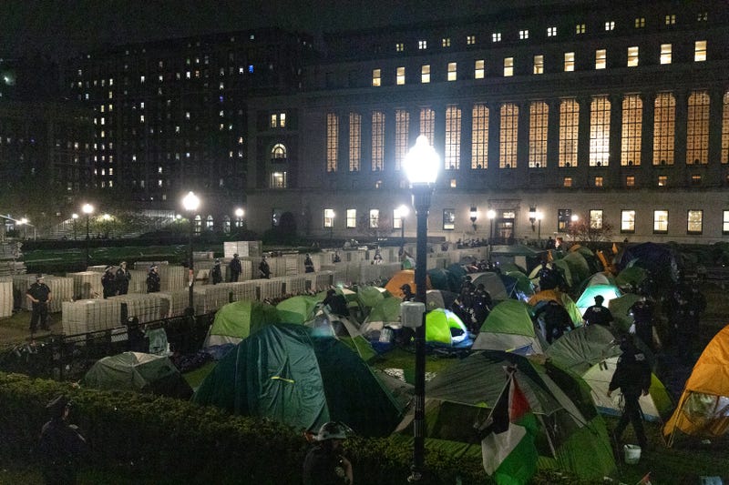 NYPD officers in riot gear enter Columbia University's encampment as they evict a building that had been barricaded by pro-Palestinian student protesters in New York City on April 30, 2024.