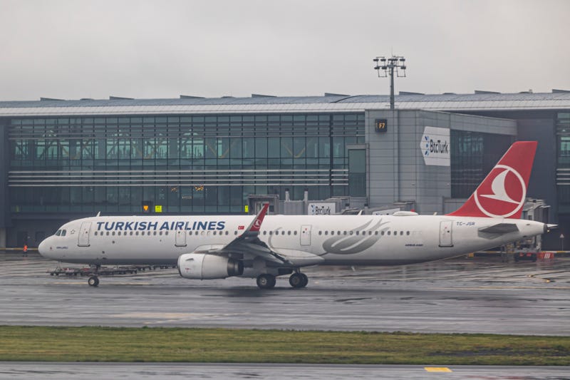 Turkish Airlines Airbus A321 with registration tail number TC-JSR taxiing. Turkish Airlines THY aircraft with the logo on the tail of the fuselage pictured on the tarmac parked and docked to the jet bridge and taxiing front of the terminal building of Istanbul Grand Airport IST. 