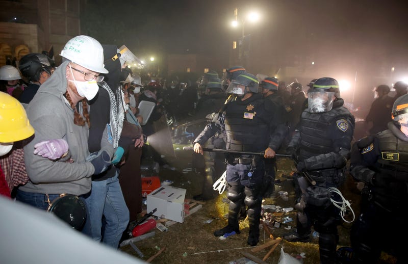 Police and protestors face off on the UCLA campus