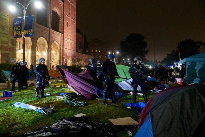Members of law enforcement take down tents in a Pro-Palestinian encampment at UCLA on May 2, 2024 in Los Angeles, California. 