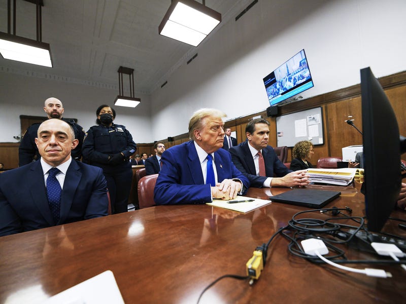 Former U.S. President Donald Trump with attorneys Emil Bove (L) and Todd Blanche (R) attends his trial for allegedly covering up hush money payments at Manhattan Criminal Court on May 3, 2024 in New York City. Trump was charged with 34 counts of falsifying business records last year, which prosecutors say was an effort to hide a potential sex scandal, both before and after the 2016 presidential election. Trump is the first former U.S. president to face trial on criminal charges.