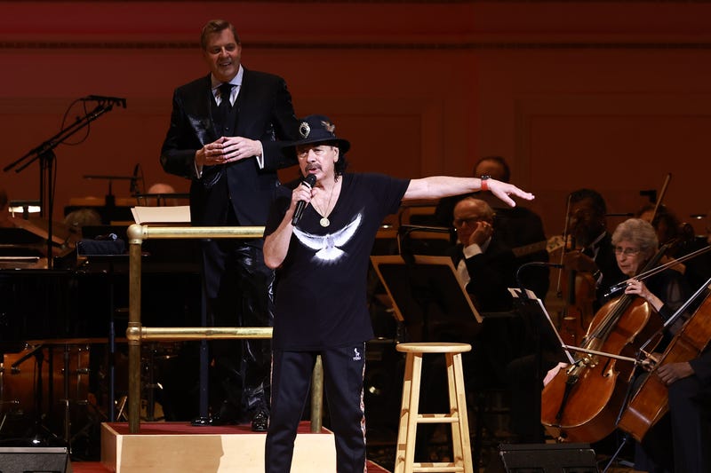 Carlos Santana performs onstage with Music Director and Conductor Steven Reineke a The New York Pops 41st Birthday Gala honoring Clive Davis on April 29, 2024, in New York City.