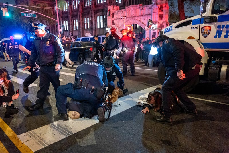 Police arrest protesters during pro-Palestinian demonstrations at The City College Of New York (CUNY) as the NYPD cracks down on protest camps at both Columbia University and CCNY on April 30, 2024
