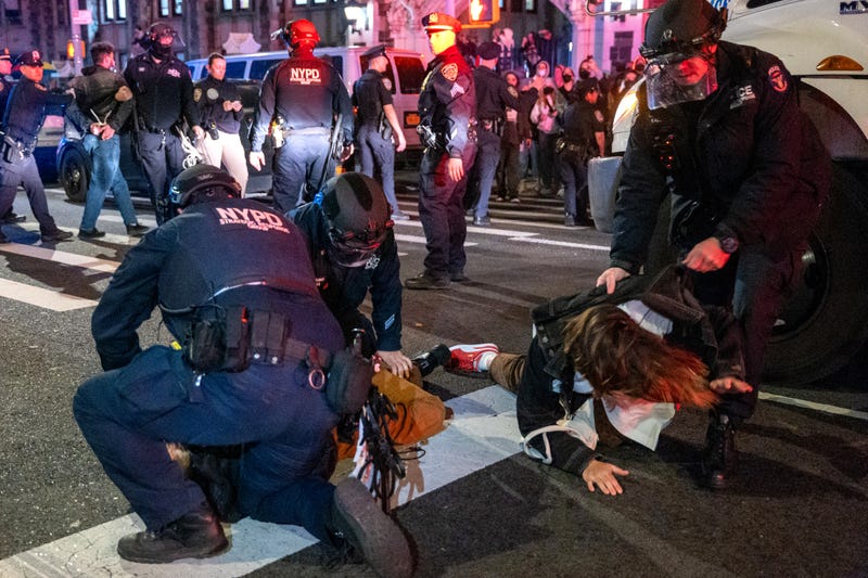 Police arrest protesters during pro-Palestinian demonstrations at The City College Of New York (CUNY) on April 30, 2024.